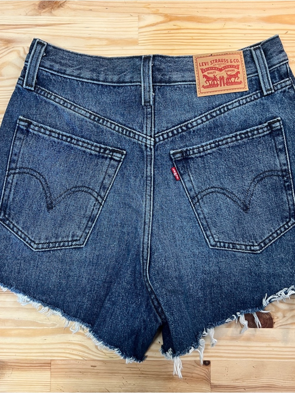 Levi's Women's Cutoff Denim Shorts in Dark Blue Jean Wash